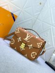 louis-vuitton-pochette-metis-bicolor-monogram-empreinte-leather-handbags-M45809_PM2_Front-view.png