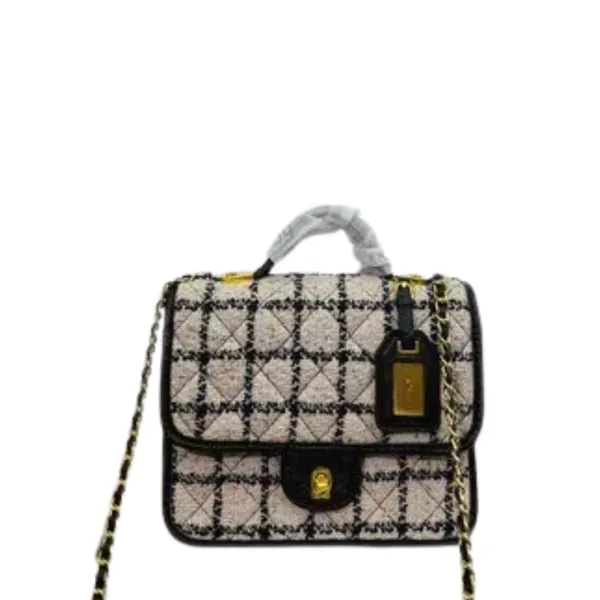 Chanel's 21cm 22k Flap Bag With Top Handle