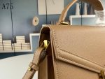 SAINT LAURENT CASSANDRA MEDIUM TOP HANDLE IN GRAIN DE POUDRE EMBOSSED DARK BEIGE
